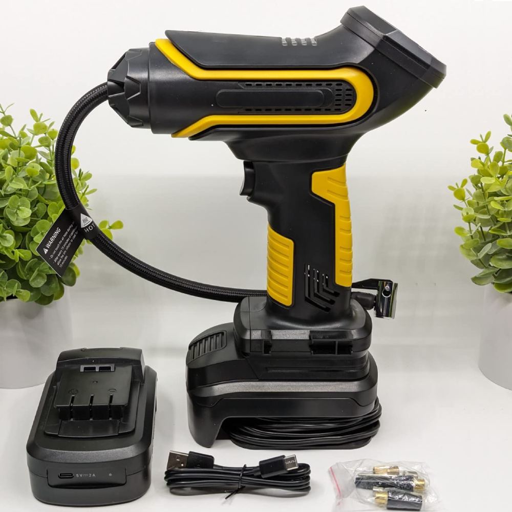 A handheld portable air compressor inflating a car tire